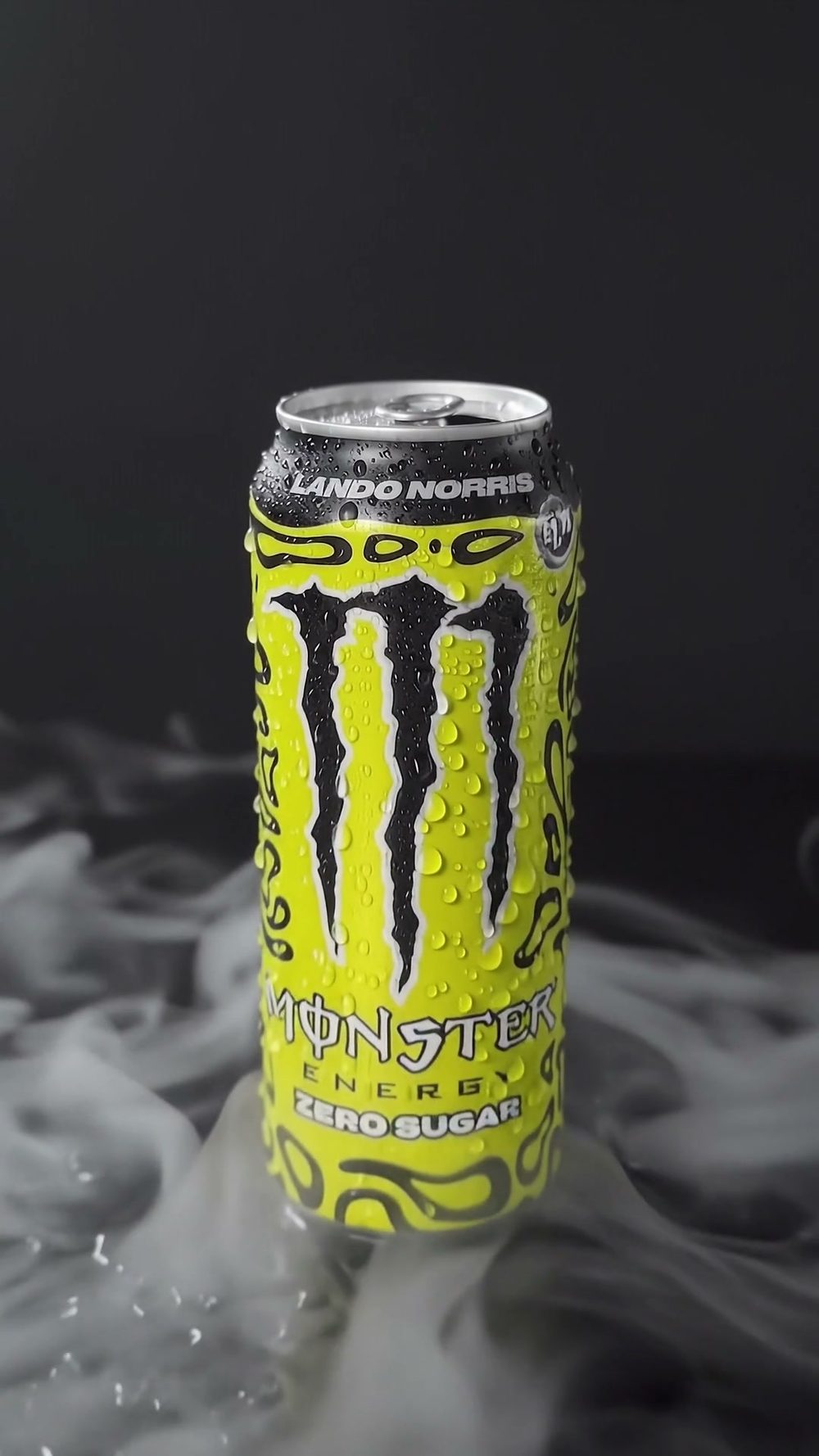 Hero frame: the can on a dark set in drifting smoke, beaded with condensation