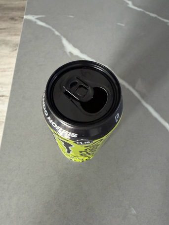 Phone photo of the same can from above, ring-pull open